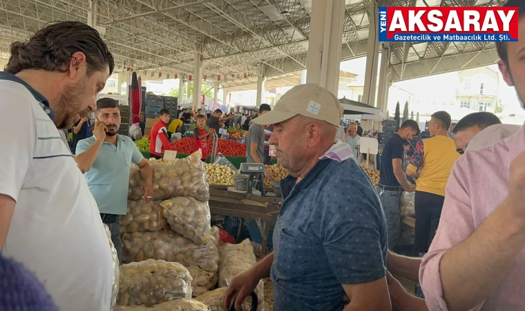 Sahte para ile Salı pazarında alışveriş yaparken yakalandı