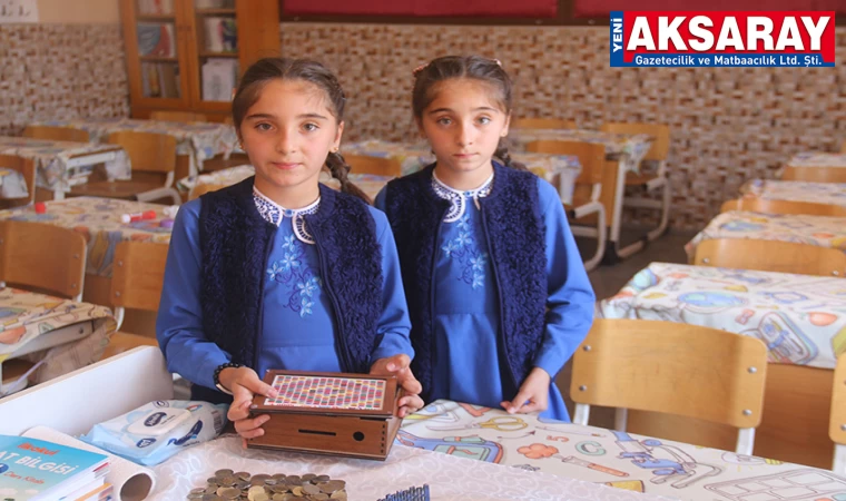 KUMBARALARINI DEPREMZEDELERE BAĞIŞLADILAR İkizlerden anlamlı bağış