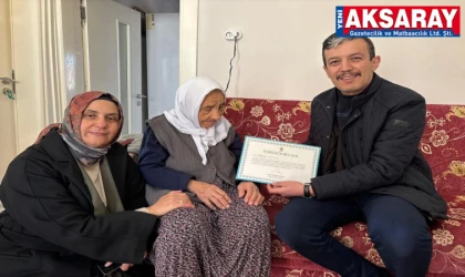 AK PARTİDE VEFA HAREKETİ En yaşlı üyeye Teşekkür Belgesi verildi